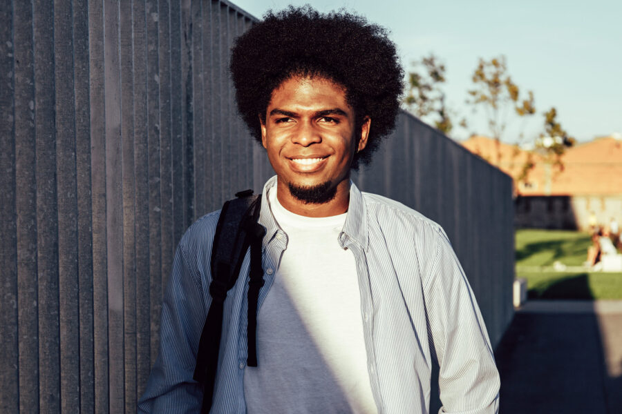 african american student man smiling outdoors